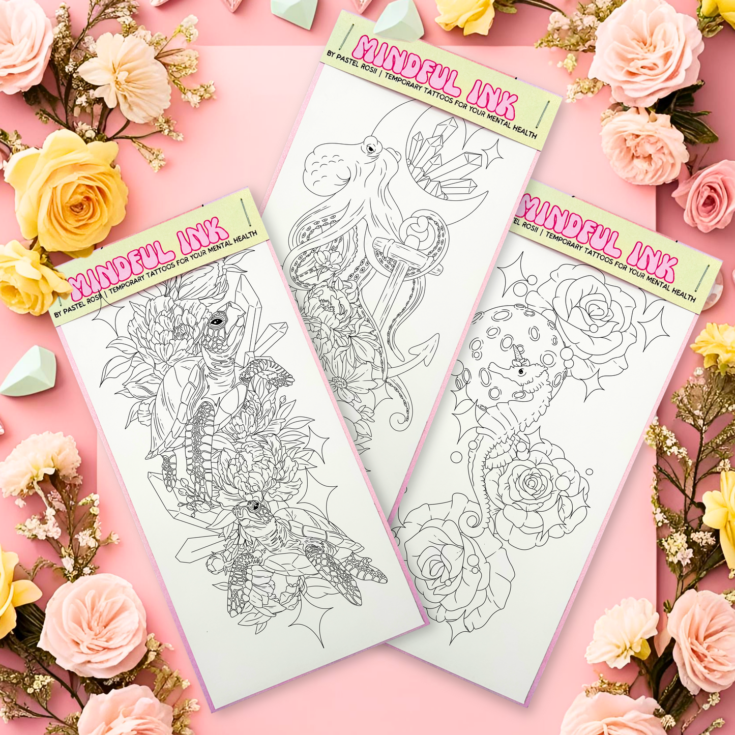Three tattoo flash sheets on a pink background with flowers