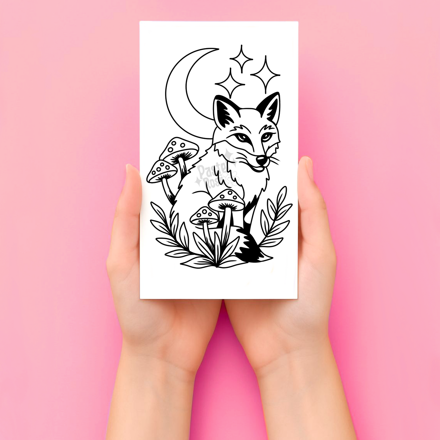 Hands holding a tattoo with a black and white fox design on a pink background