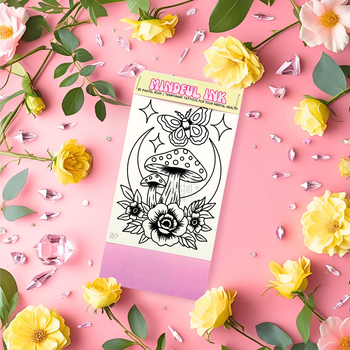 Temporary tattoos packaging on a pink background with flowers and gemstones