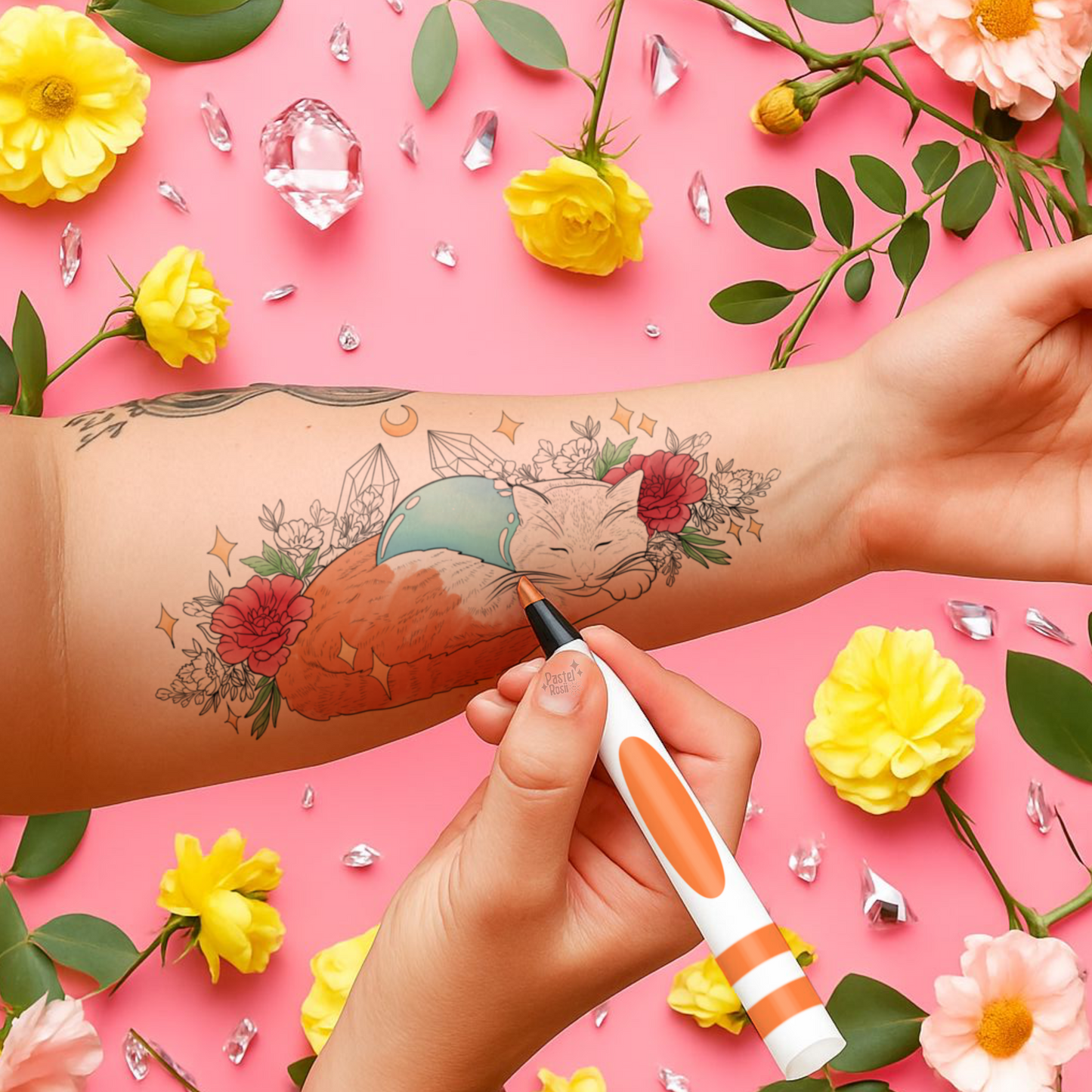 Temporary cat tattoo on a person's arm with a pink background, flowers, and a temporary tattoo pen.