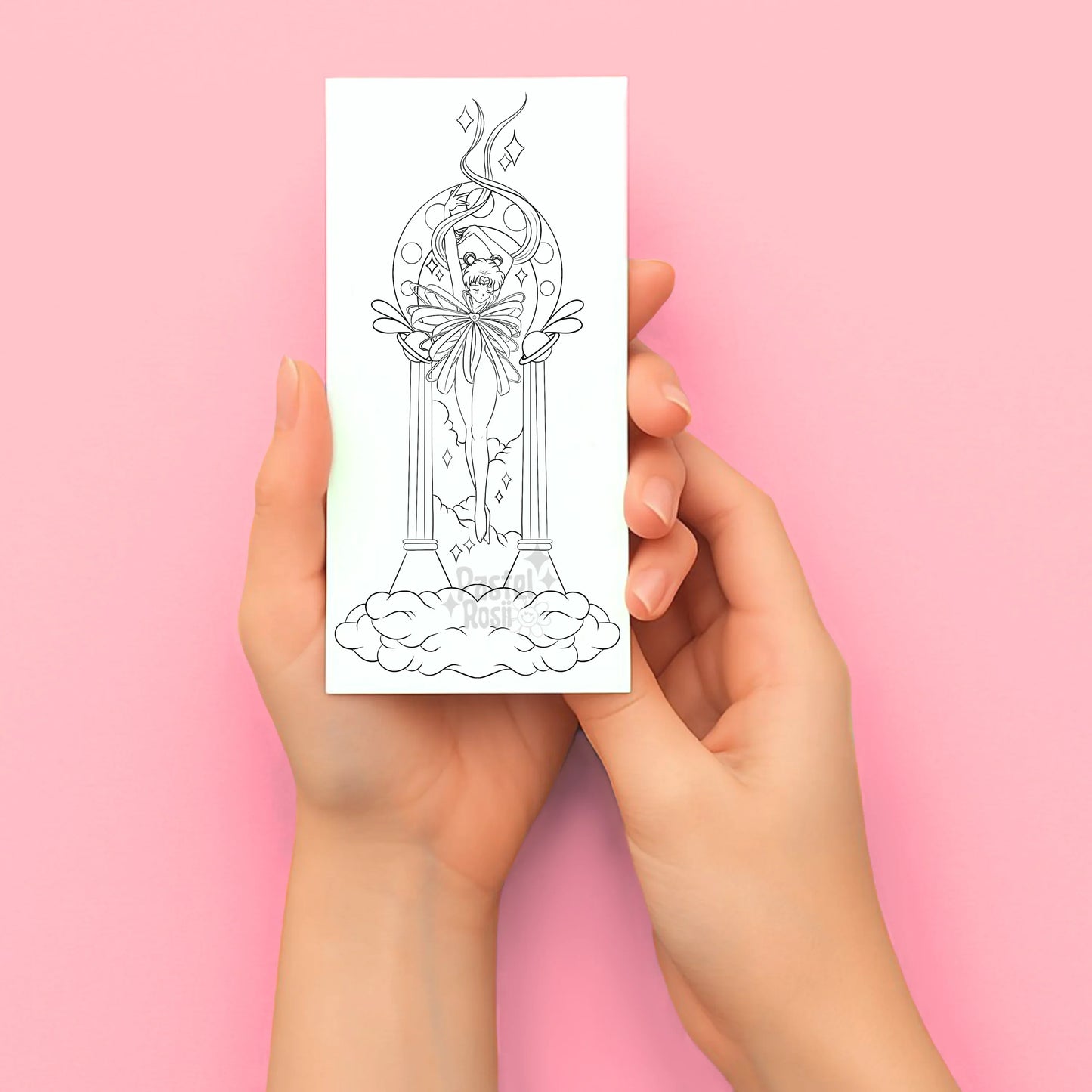 Hands holding a temporary tattoo with a black line drawing of a angelic figure on a pink background