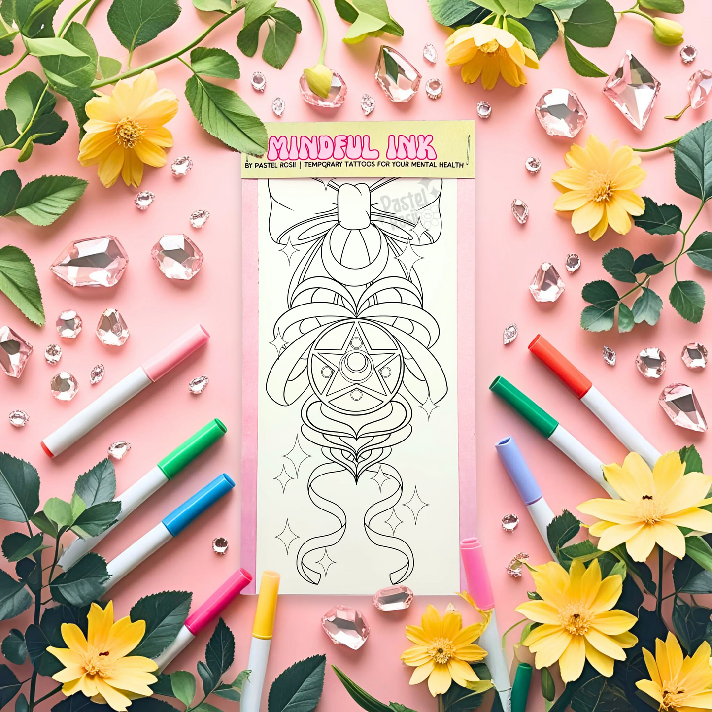 Temporary tattoo with markers and decorative elements on a pink background