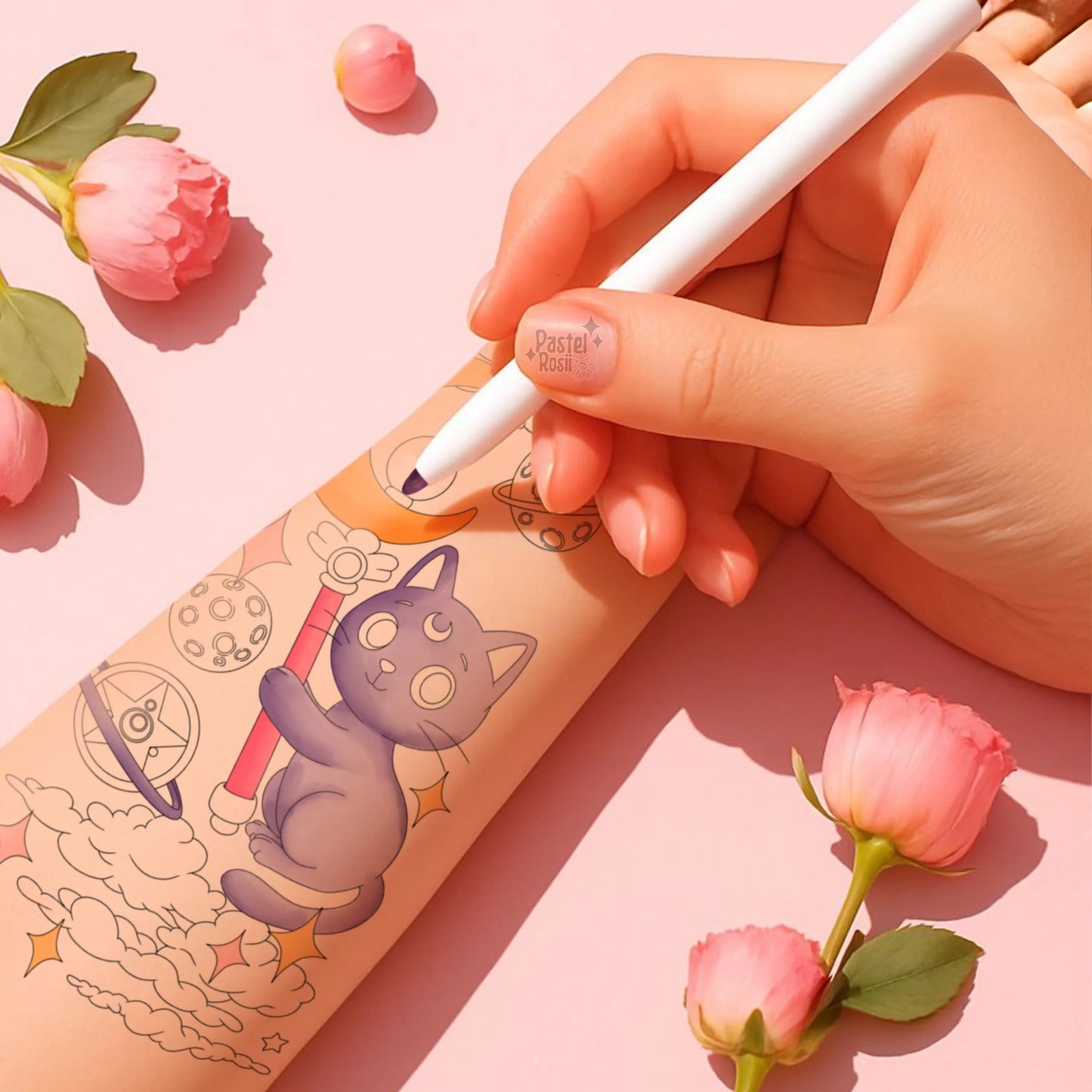 Hand holding a white pen over a tattoo design with pink flowers on a pink background