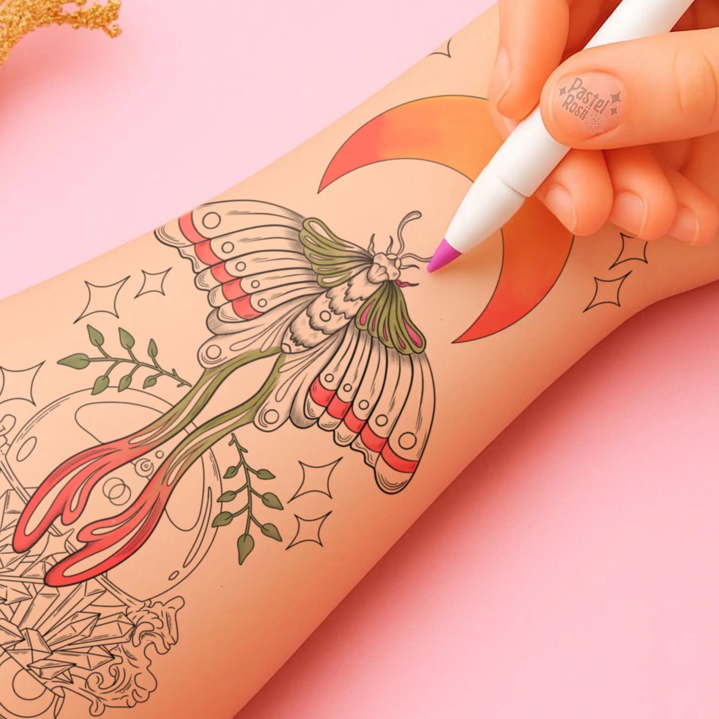 Hand with tattoo marker over a person's arm with a butterfly design on a pink background