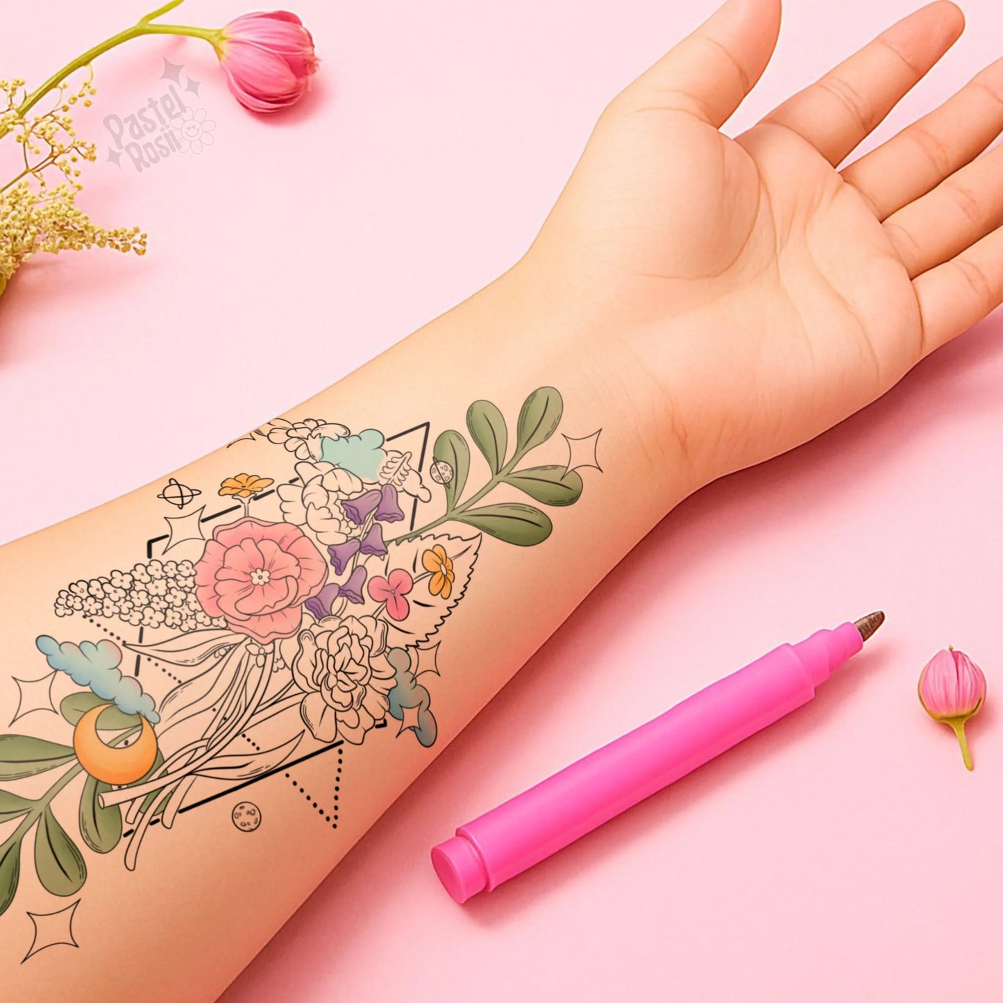 Hand with temporary tattoo and pink tattoo pen on a pink background