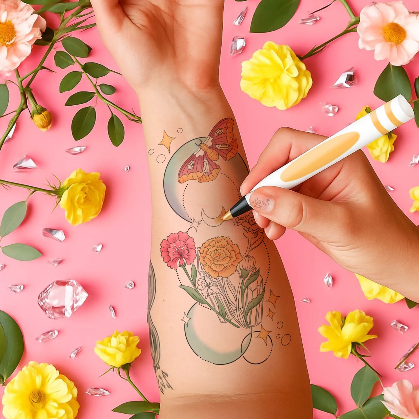 A woman is illustrating a tattoo on her arm, showcasing her artistic skills and creativity in body art.