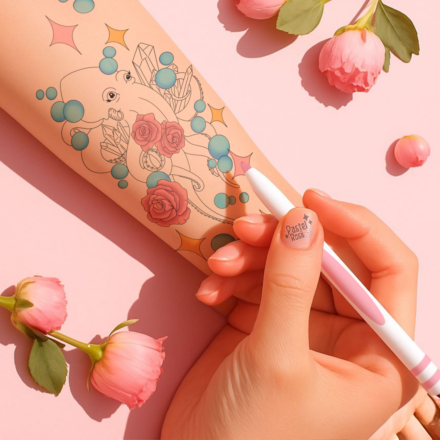 Hand with a tattoo pen and floral tattoos on a pink background with flowers.