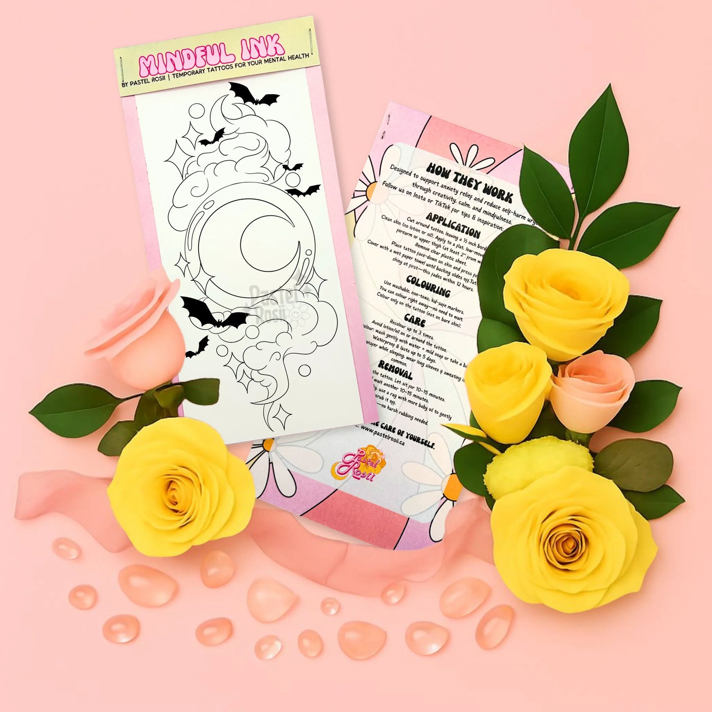 Mindful Ink product with temporary tattoo, application guide, and yellow roses on a pink background