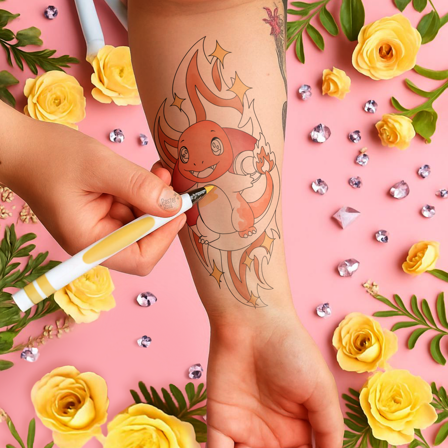 Person getting a cartoon-like dragon tattoo on their arm with a pink background and yellow flowers.