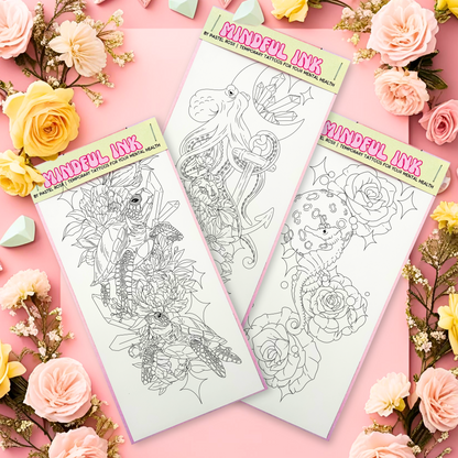Three tattoo flash sheets on a pink background with flowers