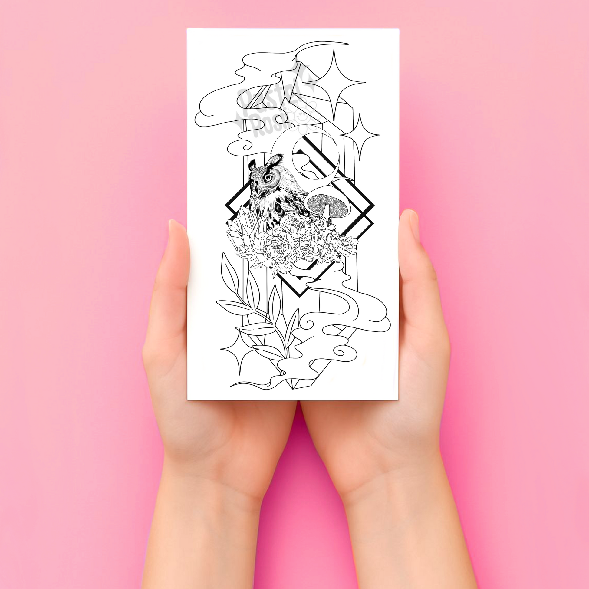 Hands holding a temporary tattoo with intricate designs on a pink background