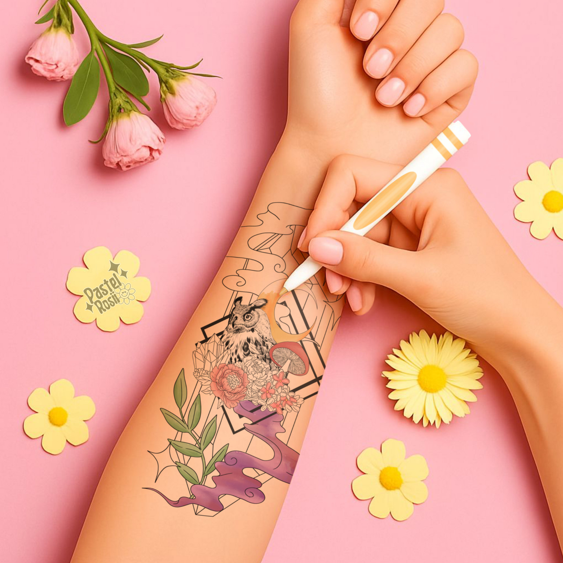 Person applying temporary tattoos on their arm with a pink background and decorative flowers.