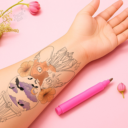 Hand with temporary tattoo of a cat and crystal design, pink pen on pink background