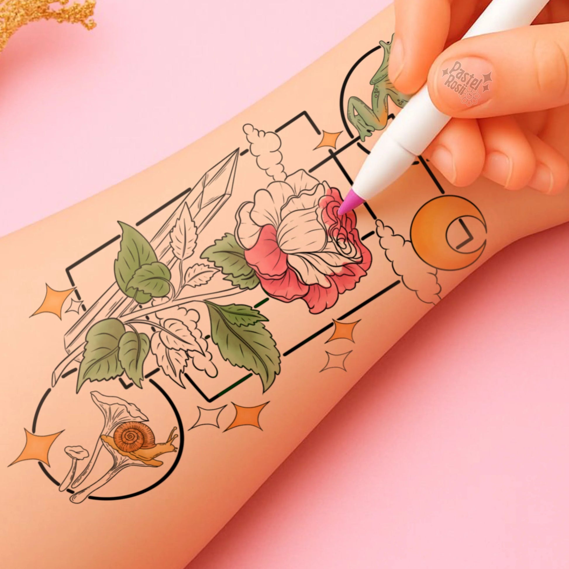 Hand with a tattoo pen coloring floral designs on skin against a pink background