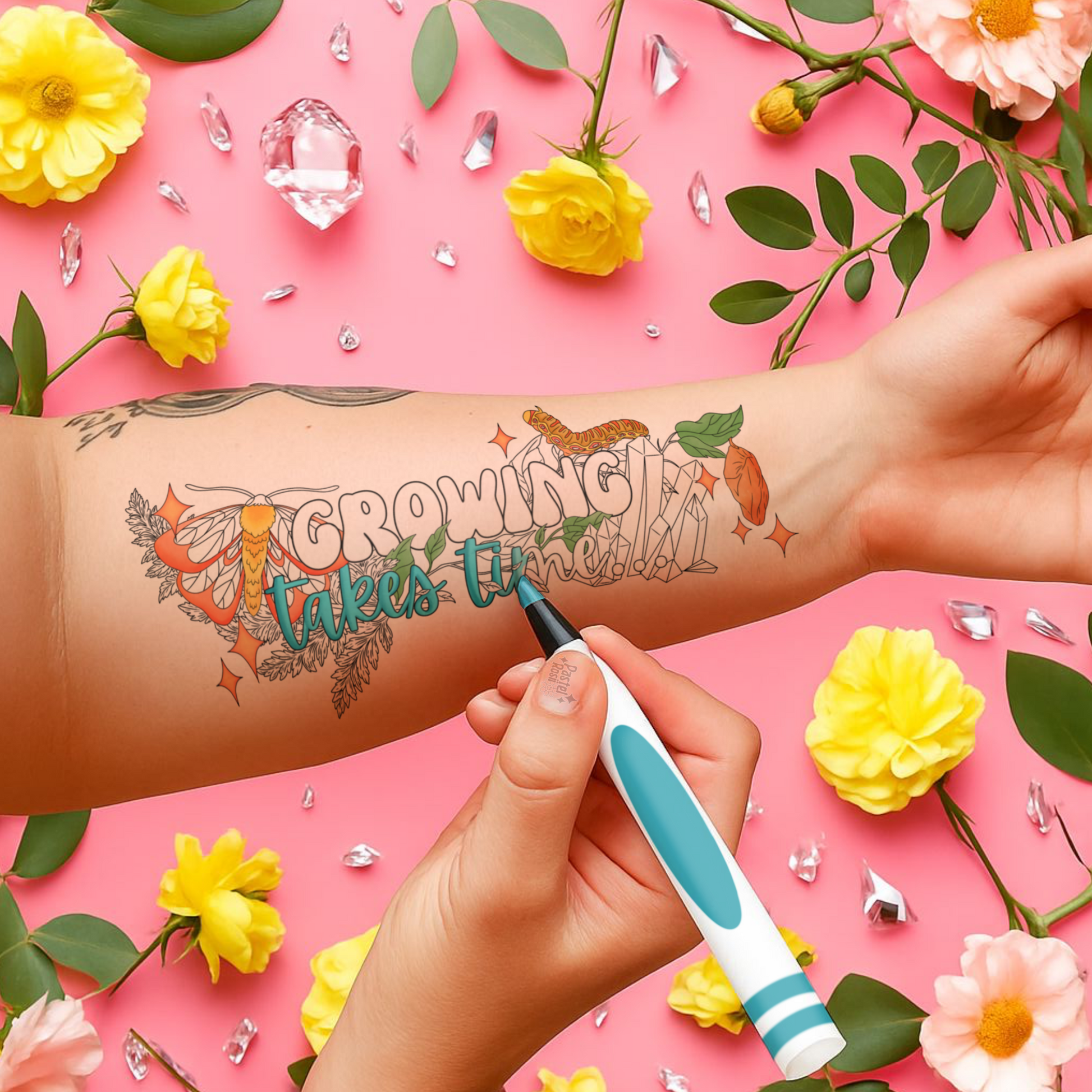 Tattoo of 'Growing takes time' on a person's arm with flowers and decorative elements on a pink background.