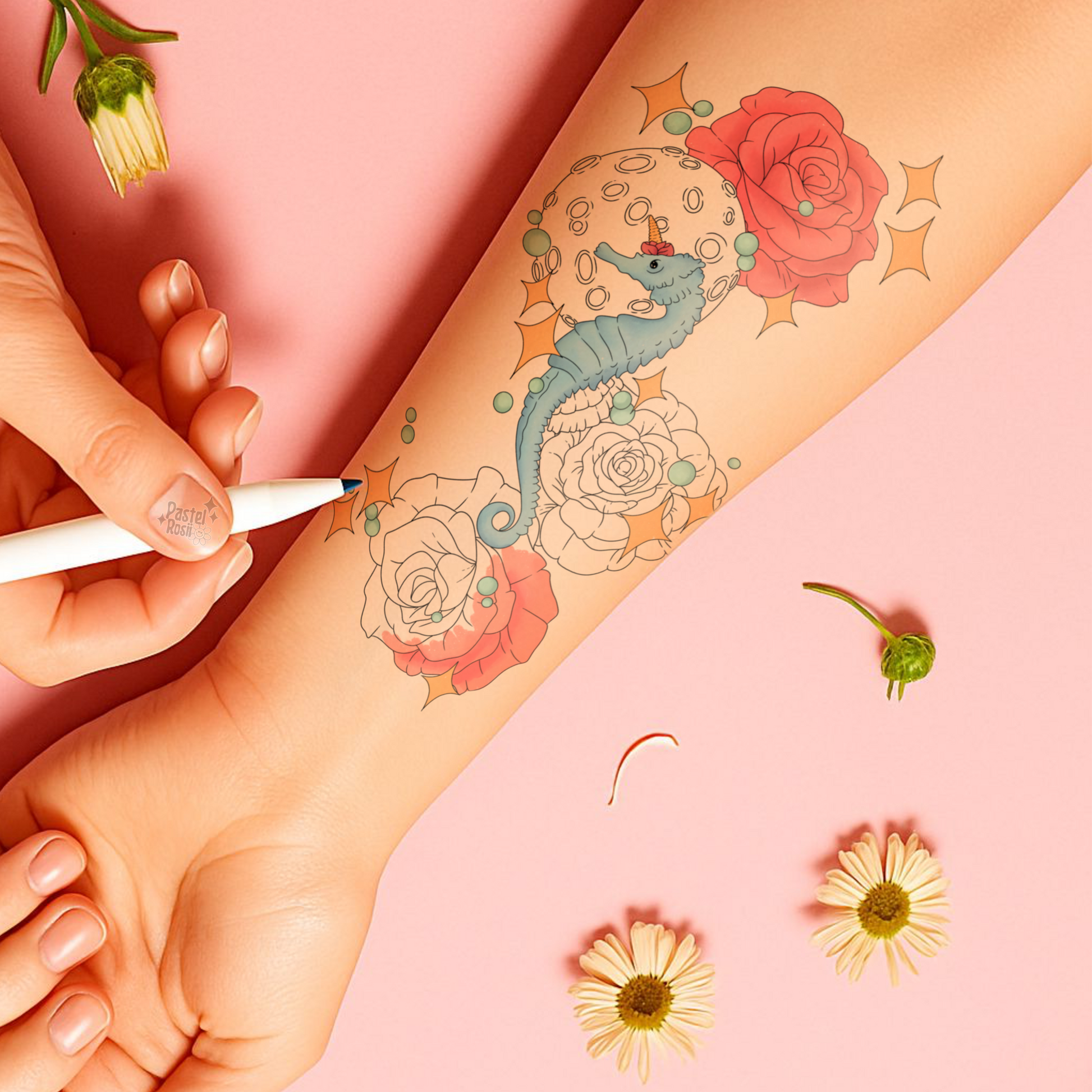 Person getting a temporary tattoo of a sea horse and flowers on their arm with a pink background.