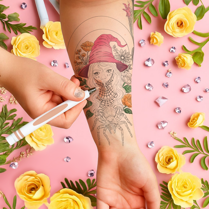 Tattoo artist applying a tattoo of a witch with a pink hat on a person's arm, surrounded by yellow roses and green leaves on a pink background.