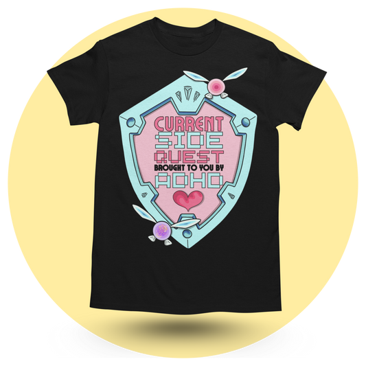 Black t-shirt featuring a colourful shield design that reads "Current Side Quest Brought to you by ADHD." Fairy elements adorn the shield.
